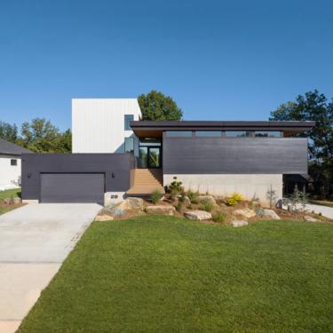 Photo of modern home painted black and white.