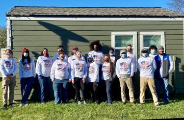 Two Men and a Truck Group Photo at Veterans Community Project