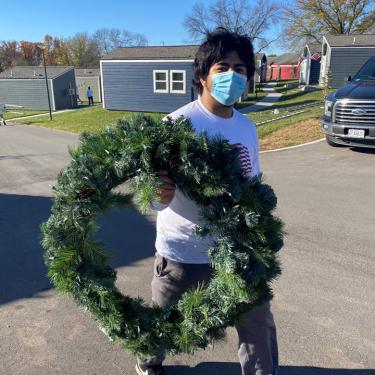 Two Men and a Truck delivering wreaths to Veterans Community Project