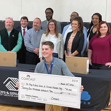 Comcast presenting giant $25,000 check to Boys & Girls Clubs Olathe Unit