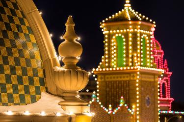 Photo of Plaza building rooftops with holiday lights